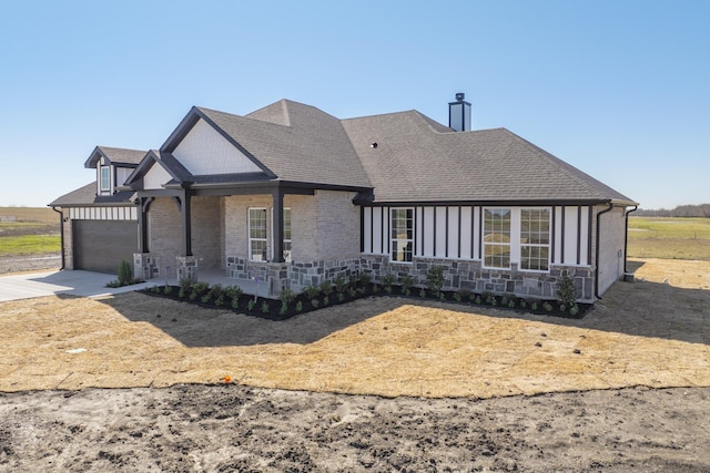 view of front of house featuring an attached garage, a porch, concrete driveway, and roof with shingles