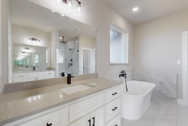 full bathroom featuring vanity, visible vents, a soaking tub, a stall shower, and marble finish floor