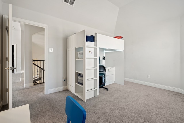 carpeted bedroom with lofted ceiling, visible vents, and baseboards