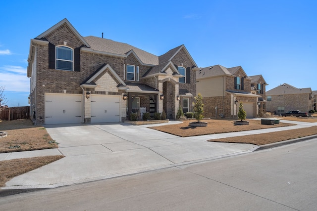 view of front of home with an attached garage, roof with shingles, concrete driveway, and brick siding