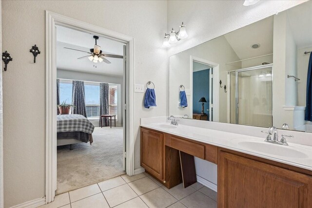 full bath featuring a sink, ensuite bath, a stall shower, and tile patterned floors