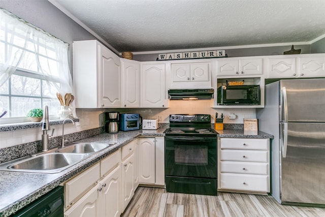 kitchen featuring backsplash, white cabinets, a sink, ventilation hood, and black appliances