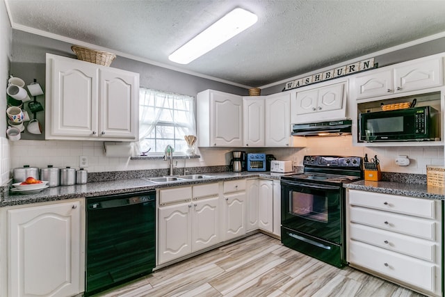 kitchen featuring dark countertops, black appliances, extractor fan, and a sink