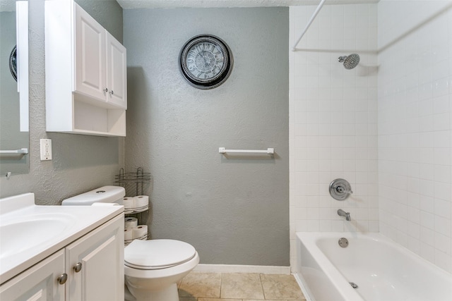 full bathroom featuring baseboards, a textured wall, toilet, tile patterned flooring, and washtub / shower combination