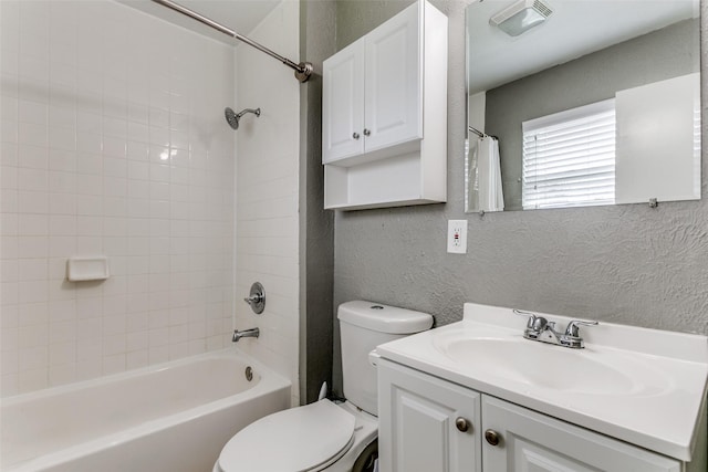 full bath featuring bathing tub / shower combination, visible vents, a textured wall, toilet, and vanity