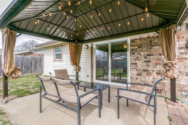 view of patio / terrace featuring fence and a gazebo