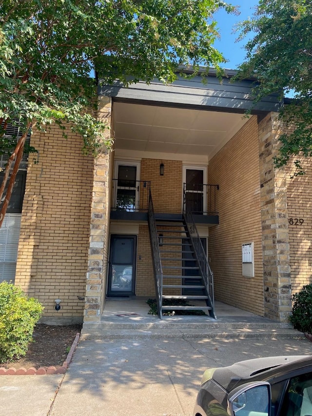 exterior space featuring brick siding