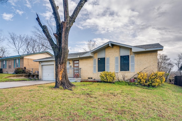 view of front of house with a front yard, concrete driveway, a garage, crawl space, and brick siding