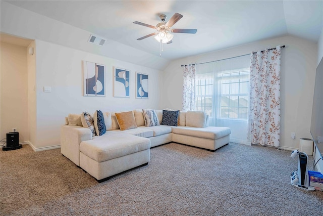 living room featuring lofted ceiling, ceiling fan, carpet flooring, visible vents, and baseboards