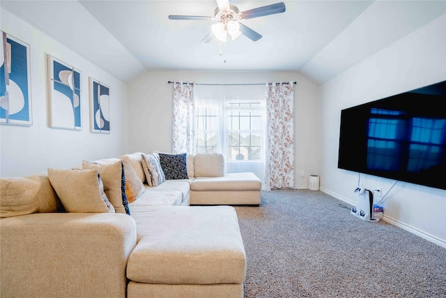 carpeted living area with vaulted ceiling, ceiling fan, and baseboards