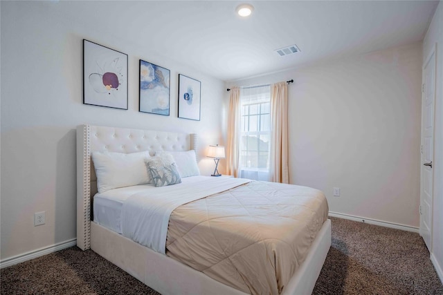 carpeted bedroom with baseboards and visible vents