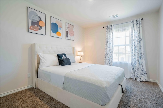 bedroom featuring carpet, visible vents, and baseboards