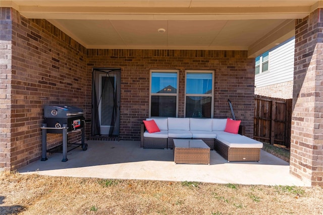 view of patio / terrace with fence, an outdoor living space, and area for grilling