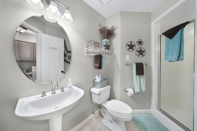 full bathroom with a stall shower, baseboards, toilet, tile patterned flooring, and a sink