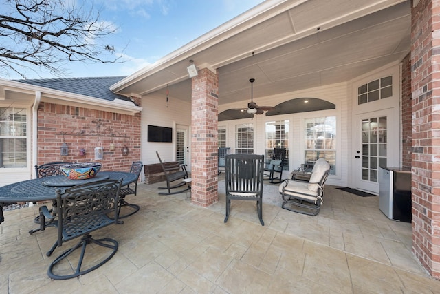 view of patio featuring outdoor dining area and ceiling fan