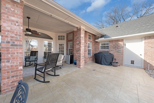 view of patio with a grill and ceiling fan