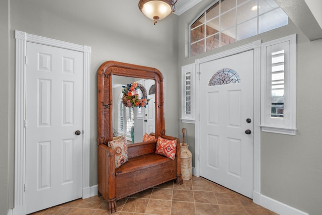 tiled entryway with baseboards