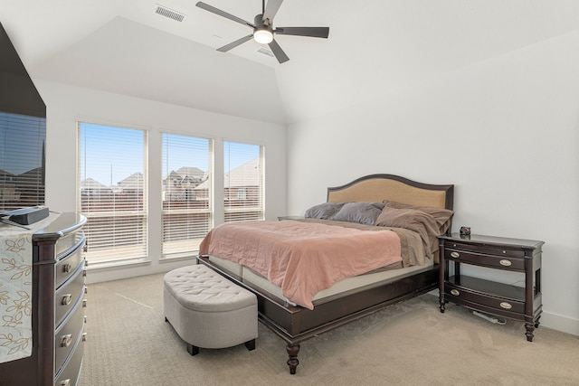 bedroom featuring light colored carpet, visible vents, vaulted ceiling, ceiling fan, and baseboards