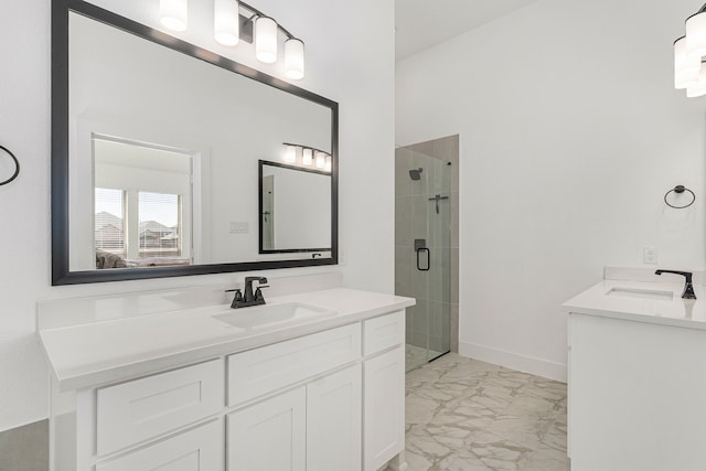 full bathroom featuring marble finish floor, two vanities, a sink, and a shower stall