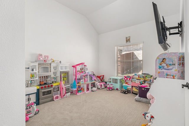 recreation room featuring lofted ceiling and carpet flooring