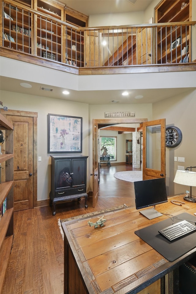 133 E Bozeman Ln, Fort Worth, TX 76108 - office space with wood finished floors, a towering ceiling, and baseboards