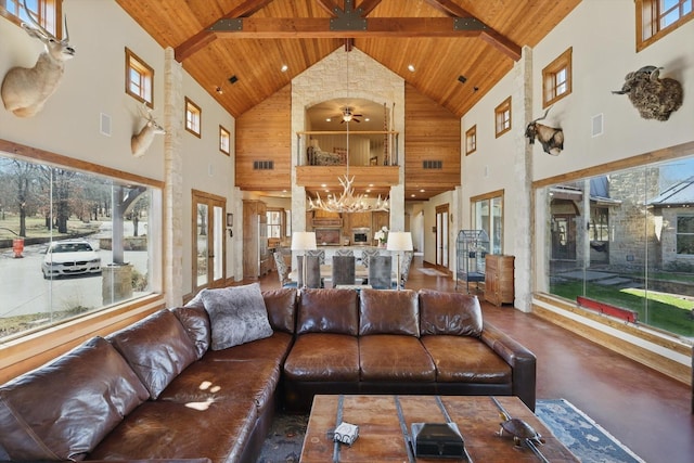 living area with visible vents, concrete flooring, wood ceiling, and vaulted ceiling with beams