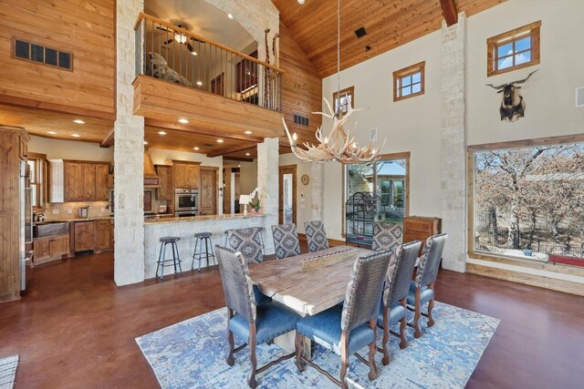 133 E Bozeman Ln, Fort Worth, TX 76108 - dining room with high vaulted ceiling, finished concrete flooring, wood ceiling, a chandelier, and recessed lighting
