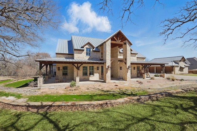133 E Bozeman Ln, Fort Worth, TX 76108 - rear view of house featuring a standing seam roof, metal roof, a patio, and a garage