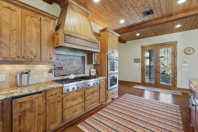 133 E Bozeman Ln, Fort Worth, TX 76108 - kitchen with appliances with stainless steel finishes, french doors, wood ceiling with exposed beams, tasteful backsplash, and dark wood-style flooring