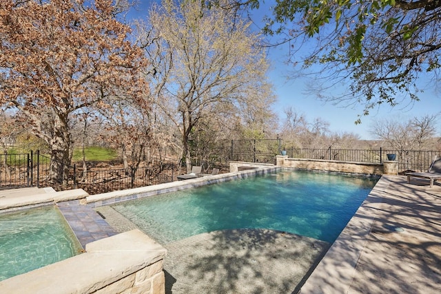 view of swimming pool featuring a patio, a fenced in pool, and fence