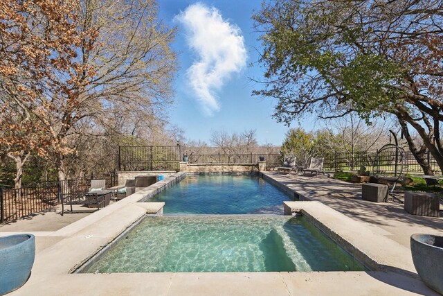 133 E Bozeman Ln, Fort Worth, TX 76108 - view of swimming pool featuring a fenced backyard, a pool with connected hot tub, and a patio