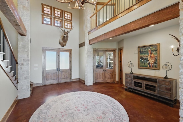 133 E Bozeman Ln, Fort Worth, TX 76108 - foyer with concrete floors, a chandelier, stairway, french doors, and a towering ceiling