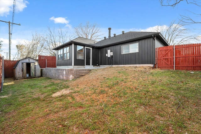 rear view of house with a fenced backyard, a storage shed, an outdoor structure, a sunroom, and a lawn