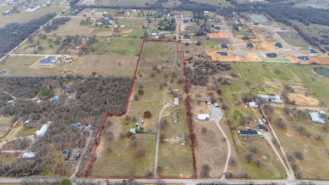 birds eye view of property featuring a rural view