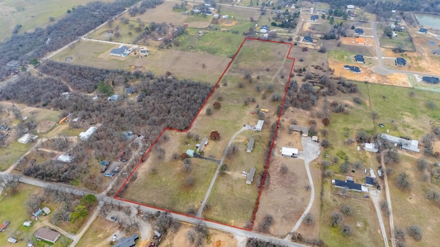 birds eye view of property featuring a rural view