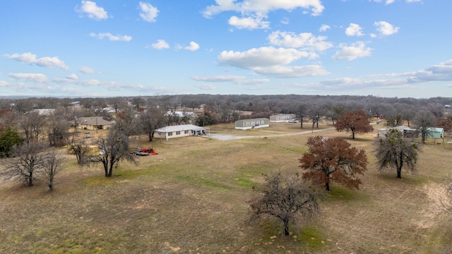 birds eye view of property featuring a rural view