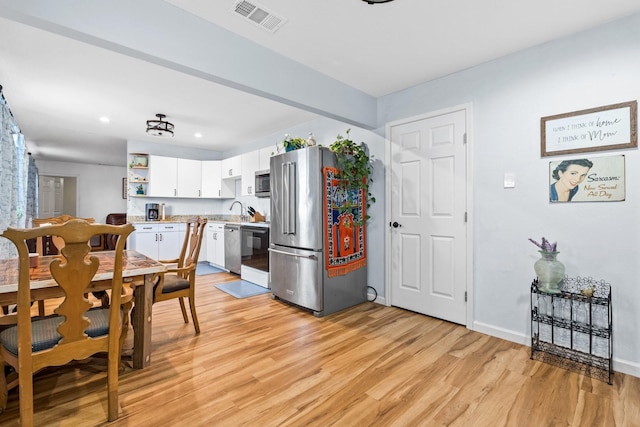 dining area with recessed lighting, visible vents, baseboards, and light wood finished floors