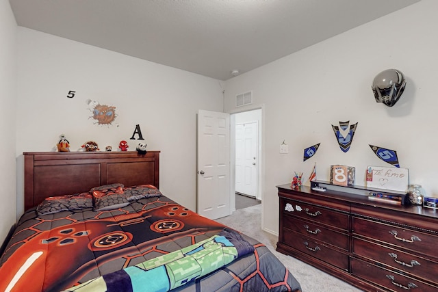 carpeted bedroom with visible vents