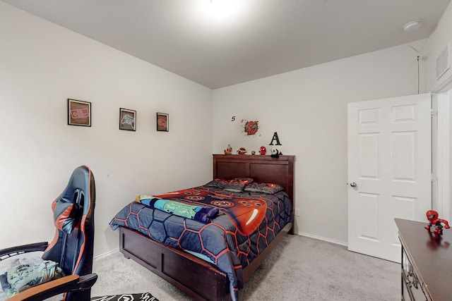 bedroom featuring carpet floors and baseboards