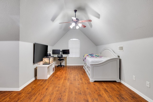 bedroom featuring vaulted ceiling, ceiling fan, wood finished floors, and baseboards