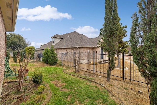 view of yard featuring a fenced backyard