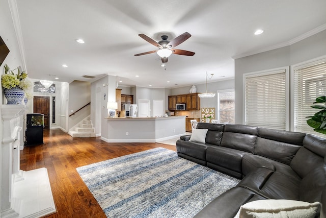 living room with crown molding, recessed lighting, wood-type flooring, stairway, and baseboards