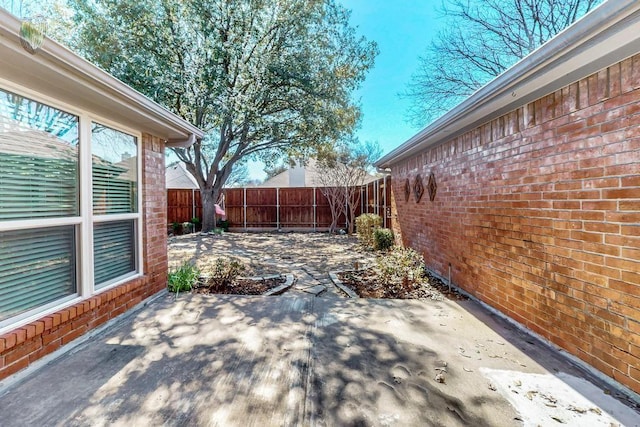 view of patio featuring a fenced backyard