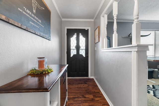 entryway with a textured ceiling, a textured wall, baseboards, ornamental molding, and dark wood-style floors