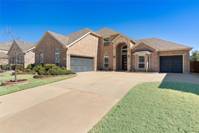 traditional-style house with a garage, concrete driveway, and brick siding