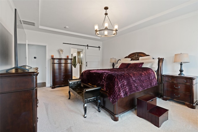 bedroom featuring ornamental molding, a barn door, visible vents, and light colored carpet