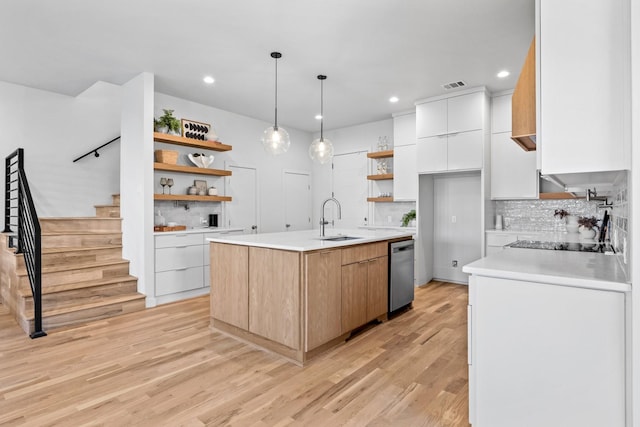 kitchen featuring modern cabinets, open shelves, a sink, and light countertops