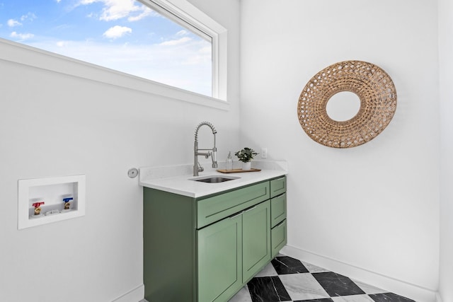 bathroom with vanity and baseboards