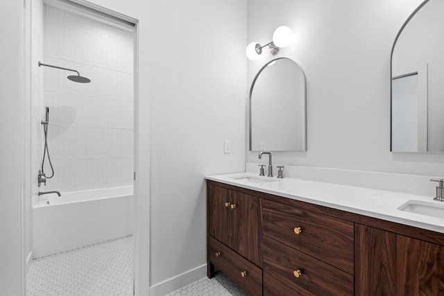 full bathroom with double vanity,  shower combination, and a sink