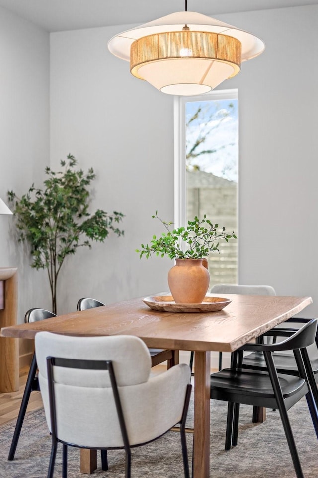 dining area with wood finished floors